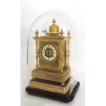 French brass two train mantel clock striking on a gong, the 3.25" cream chapter ring enclosing a