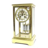 French brass two train four glass mantel clock striking on a bell, the 3.75" chapter ring