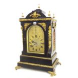 English ebonised boardroom triple fusee mantel clock, the substantial movement playing on a nest