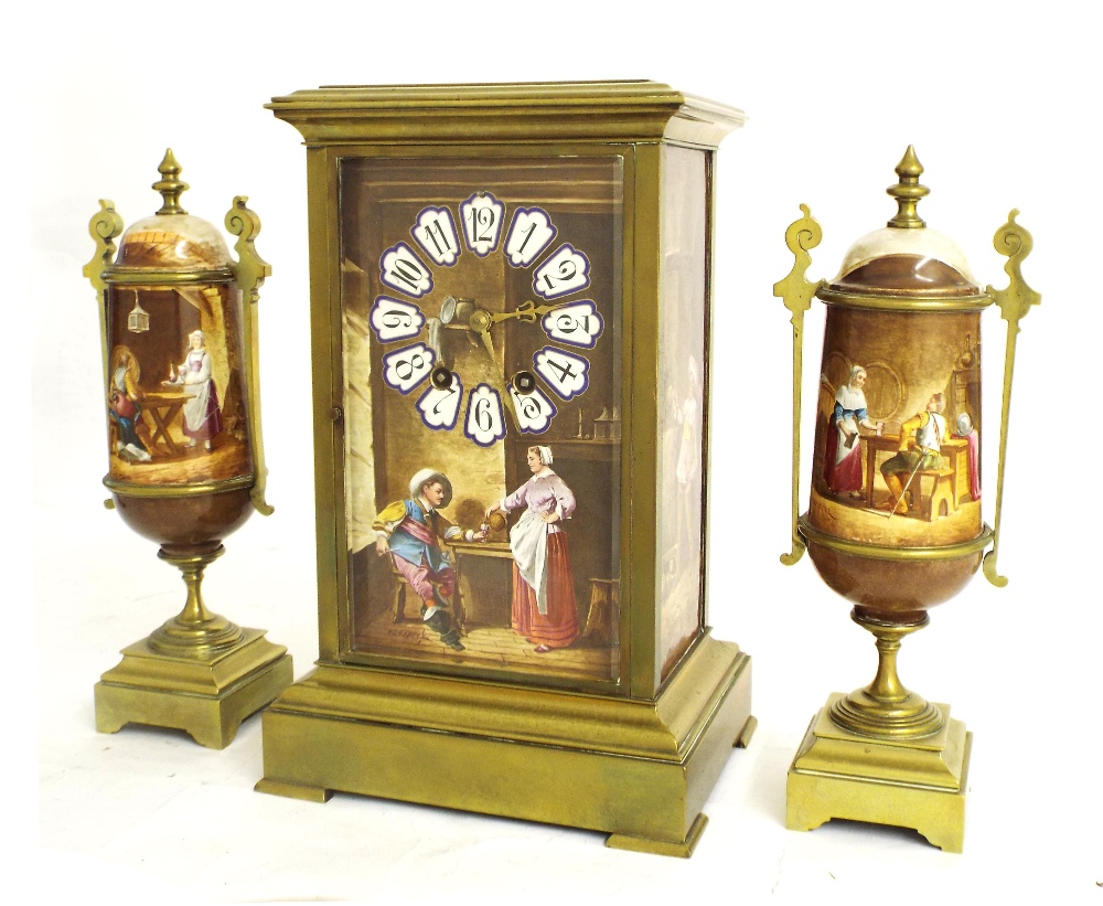 Brass and porcelain panelled two train mantel clock garniture striking on a gong, the front and side