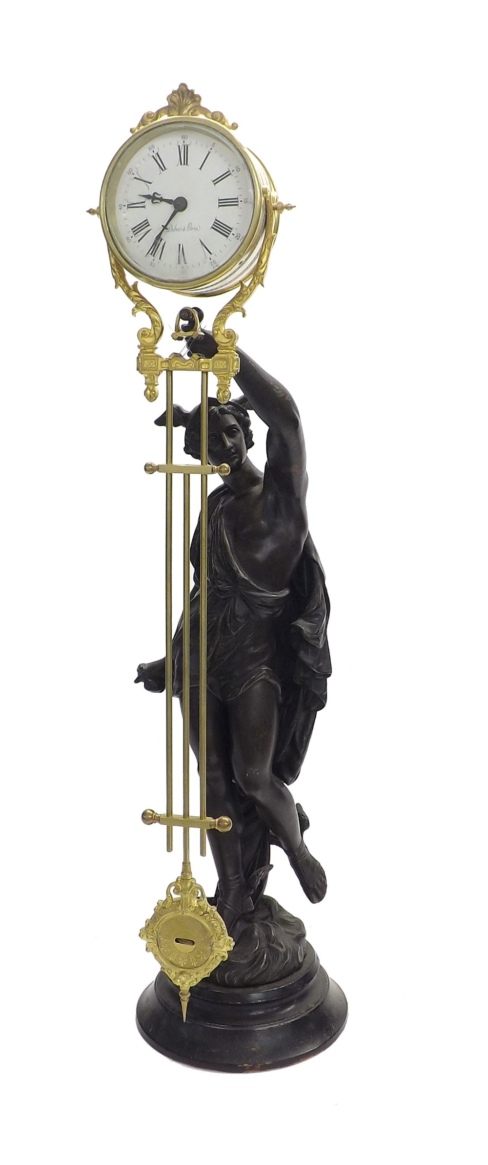 Spelter figural swinging mystery clock, the 3.75" dial signed Dubuc a Paris, within a drumhead