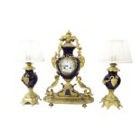 French gilt metal and cobalt blue porcelain two train mantel clock garniture, the movement with