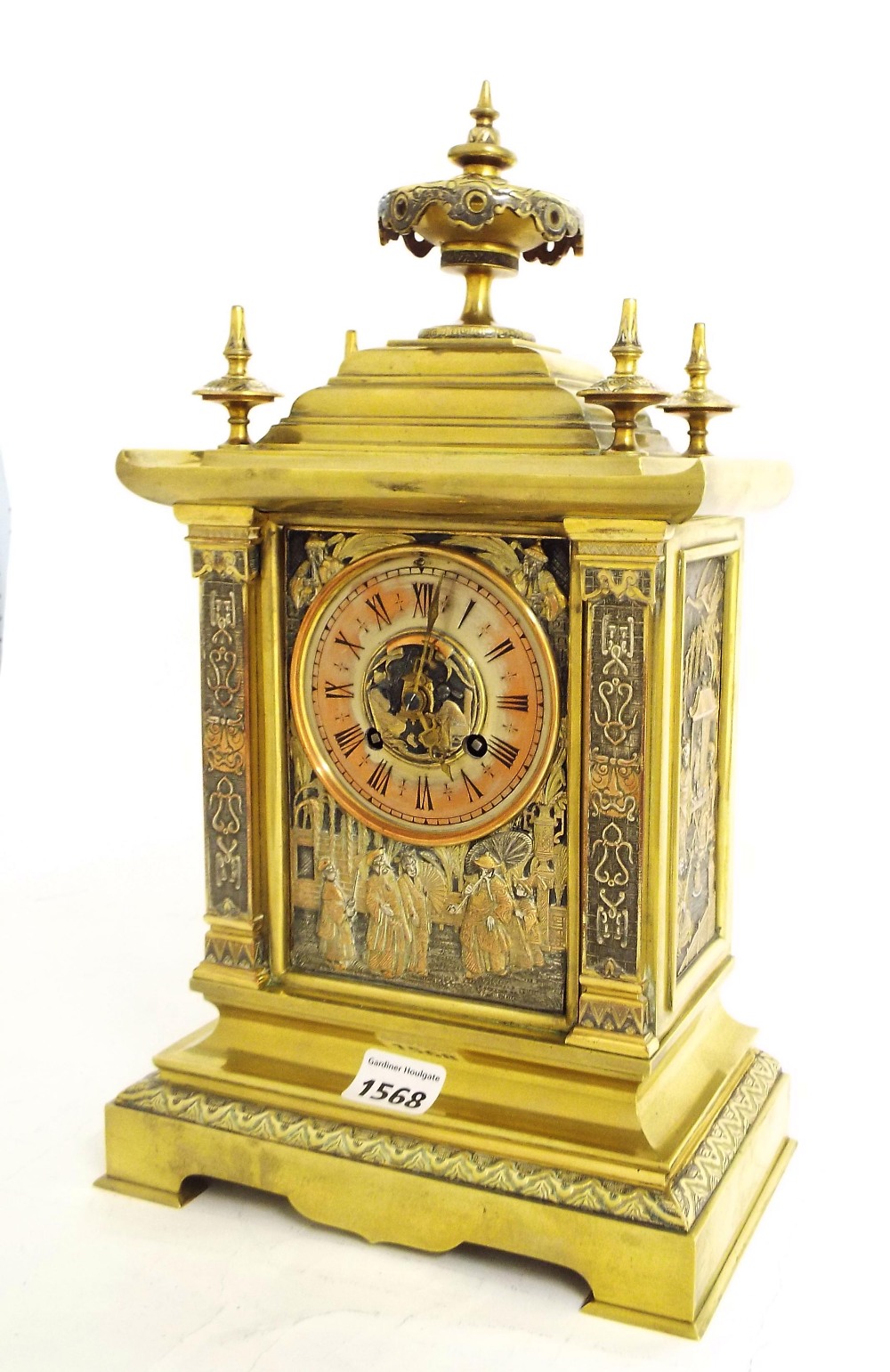 Brass chinoiserie two train mantel clock striking on a gong, the 3.5" dial within a stepped temple