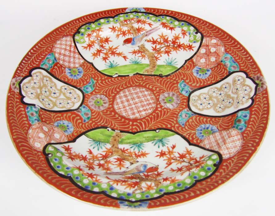 A 19th Century Chinese charger, with vignettes of birds and flowers against a red ground, diameter