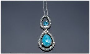 Larimar and Blue Topaz Pear Drop Necklace, comprising a pear cut cabochon of the rare gemstone