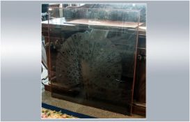 Large Smoky Brown Glass Window with a deep engraving of a peacock in all its glory. 43 by 46