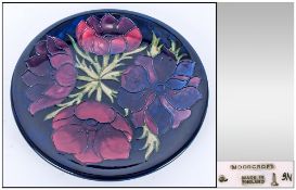 W.Moorcroft Modern Cabinet Plate 'Clematis' Design on dark blue ground. Circa 1990's. 10'' in