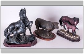 Three Ceramic Animal Figures On Plinths, one of a highland bull, the other of horses with foals.