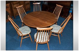 A Set of 6 Ercol Windsor Back Chairs. Together with an Ercol, drop leaf dining table.