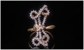 18ct Gold Diamond Cluster Ring In The Form Of A Bow Set With Round Brilliant & Baguette Cut