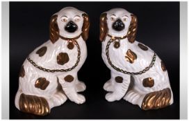Pair Of Spaniel Pottery Dogs with gilt trim.  Some age related crazing, but generally good.