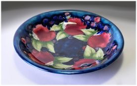 Moorcroft Shallow Bowl 'Pomegranates' On Blue Ground Marked to base 'Potters To The Queen' 7.25'' in