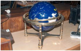 Reproduction Enamelled World Globe on a brass four legged stand. With a compass combined cross