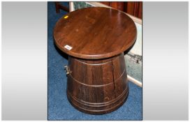 Oak Tavern Type Table in the shape of an oak cask. With a cupboard front 21 inches high