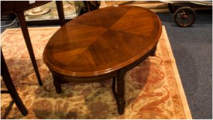 Oval French Style Mahogany Coffee Table on 4 reeded square legs with a shaped under carriage. 44