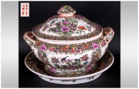 A Chinese Canton Style Large Tureen On Base with Famille Rose decoration with birds amongst flowers.