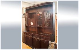 A Contemporary Mahogany Finish D Ended Side Cabinet with glazed top. With a four cupboard base above