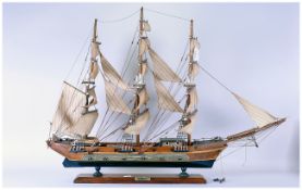 A Vintage Boxwood Model Sailing Ship of the Late 19th Century Raised on a wooden stand. 23.5'' in