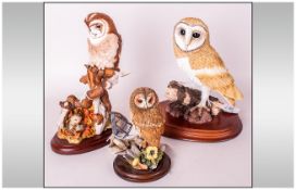 Three Various Owl Figures, the first, at 7.75 inches high including the base, from The Leonardo