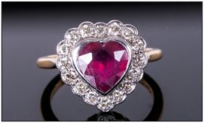 18ct Gold Heart Shaped Ruby & Diamond Ring The heart shaped ruby of good colour surrounded by 16