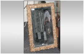 A Moulded Acorn Decorated Framed Mirror with gold highlights and bevelled glass. 16x26''