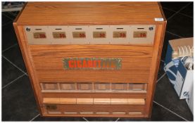 Vintage Cigarette Machine. 6 Slots with wooden pull out slots at the bottom. Signage says 30p.