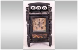 Black Ebonised Aesthetic Movement Mantle Clock with turned spindles to the sides and a silvered