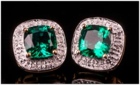 9ct Gold Diamond Stud Earrings Set With A Central Green Faceted Stone Surrounded By Diamond Chips,