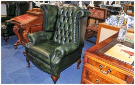 Fine Pair of Matched Green Leather Buttoned Backed Georgian Style Winged Armchairs of Robust Form