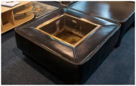 Contemporary Brown Leather Jardiniere with a central brass planter, supported on a stained wood