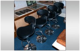 Set of Four Contemporary Chrome and Black Bar Stools.