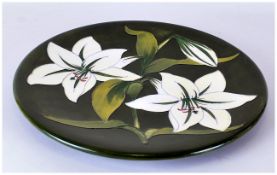 W.Moorcroft Signed Charger 'Arum Lily' Pattern. Label to base reads 'Potters to late Queen Mary'