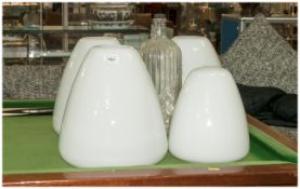 Four Shaped Opaque Glass Industrial Shades, with a Moulded Poison Glass Bottle.