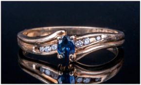 9ct Gold Dress Ring Set With A Central Sapphire Set Between 6 Round Cut Diamonds, Fully