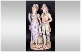 Large German Bisque Figure Group of a romantic couple in Regency attire, both in pastel shades