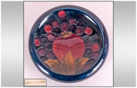 Moorcroft Small Footed Bowl, Pomegranates and Berries Pattern on Blue Ground. Diameter 4.25 Inches.