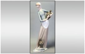 Lladro Figure ' The Jug Carrier ' Model No.4875. Issued 1974-1985. Height 12.5 Inches..