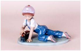 Lladro Figure 'All Aboard'. Numbered 7619. Height 5.25 inches. Complete with box.
