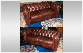 Matching Pair Of Brown Leather Buttoned Back Two Seater Settees with rolling arms and back, 63'' &