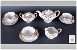 Nippon Part Tea Set comprising 3 trios, tea pot, lidded two handled sugar bowl, milk jug, (12)