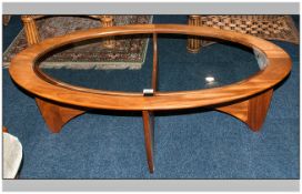 G Plan Oval Coffee Table with a glazed top on a contemporary shaped base. 48 inches wide.
