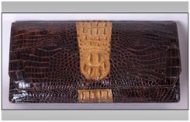 Alligator Clutch handbag zip compartment on the inside also includes a small key ring and a pouch