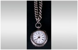 A Swiss Ornate Cased Silver Open Faced Pocket Watch with white porcelain dial. marked 935. Circa