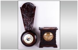 Carved Oak Aneroid Barometer. Together with a 1930's Bedroom Clock. With a round brass dial.