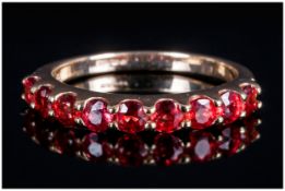 Ladies 9ct Gold Nine Stone Ruby Ring the rubies of good colour. Marked 375.