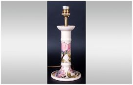 Moorcroft Lamp Base in a candlestick style with pink hibiscus on a cream ground; 8 inches high