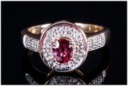 Ladies 9ct Gold Ruby & Diamond Cluster Ring the central ruby of good colour surrounded by small