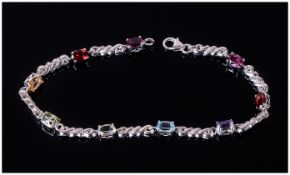 Multi Gemstone Bracelet comprising oval cuts of rhodolite and red garnet, citrine, peridot, green