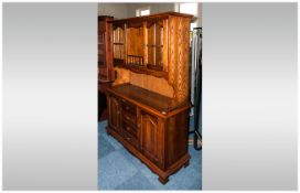 Reproduction Oak Sideboard with a glazed cabinet top. With cupboards and drawers below and two