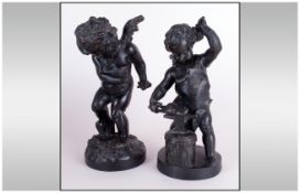 Pair of French Spelter Figures of Putti, one holding a garland and one working on an anvil.